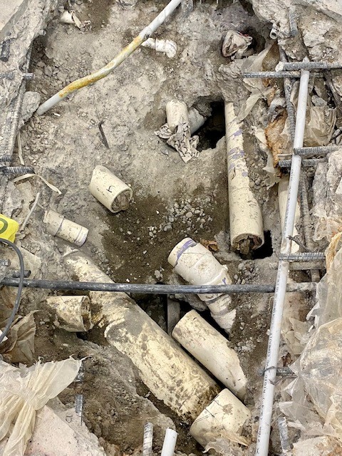 several broken pipes are seen in the ground